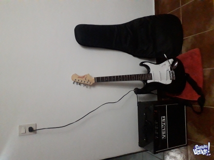 Vendo o permuto (por Ps3), una Guitarra Electrica con correa +amplificador con cable +funda negra 