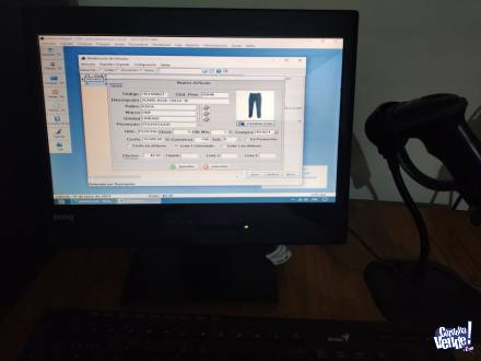 Computadora con sistema de control de stock y ventas.